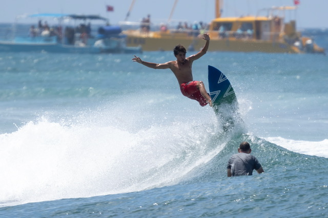Surfer catching a wave